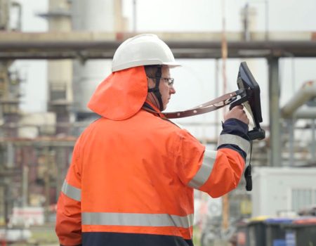 Oil and gas man holding camera